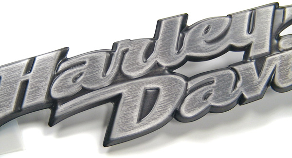 The antiqued finish on the Harley Davidson badge was hand rendered and 